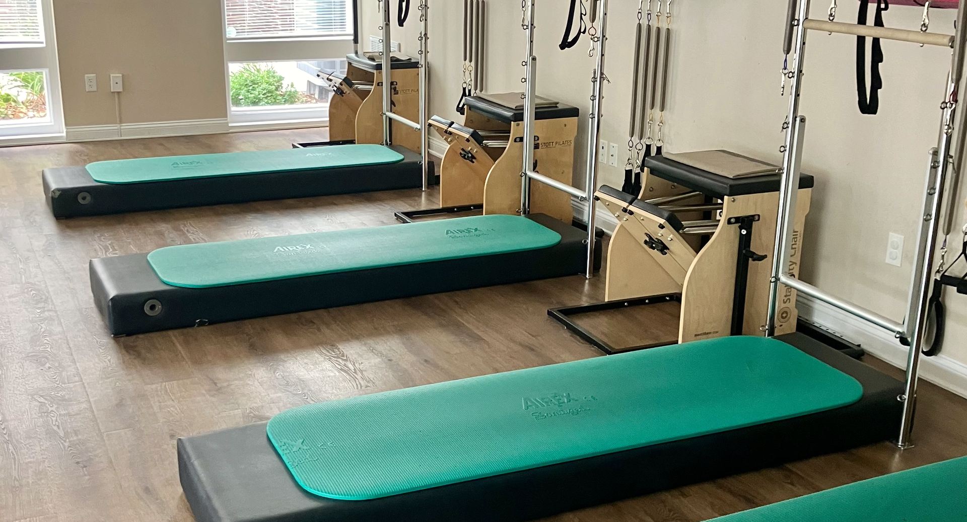 Tower stations, wooden stability chairs and teal mats in the studio.